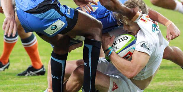 Damian McKenzie is tackled by Marcel Brache of Force during the Chiefs' win. Photo / Getty