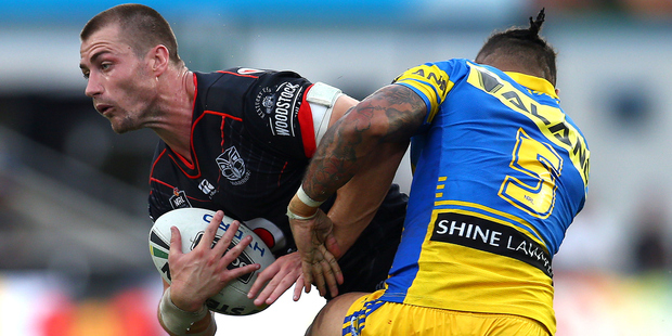 Kieran Foran is tackled by Josh Hoffman during Warriors v Paramatta Eels NRL match. Photo/Photosport