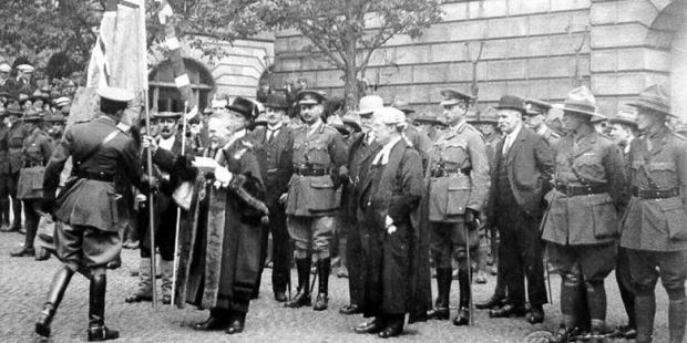 Photos from the 1919 ceremony of the Mayor of Stafford presenting NZ troops with a Union Jack and the New Zealand Ensign