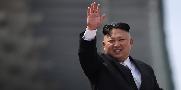 North Korean leader Kim Jong Un waves during a military parade on Saturday. Photo/AP