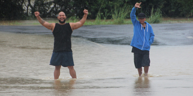 Noble Tua (left) and Michael Wilcox abandoned their car and make their way to Kaeo on foot to stock up on essentials in case Cyclone Cook pushed floodwaters even higher.