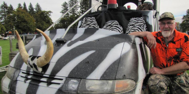 Robert Evans, of Invercargill, of the "Hokonui A Team'', shows off his prize-winning vehicle. Photo / Pam Jones
