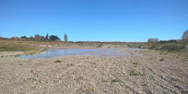 The waters of the Selwyn River crept back over formerly dry gravel following recent rainfall. Photo / Christchurch Star
