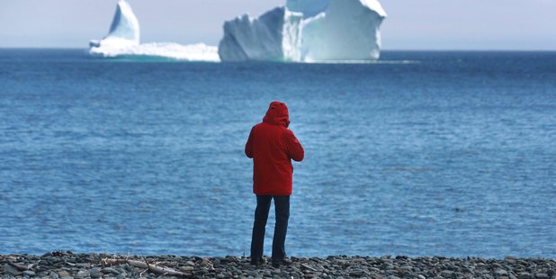 A large iceberg is visible from the shore in Ferryland, an hour south of St. John's, Newfoundland. Photo / AP