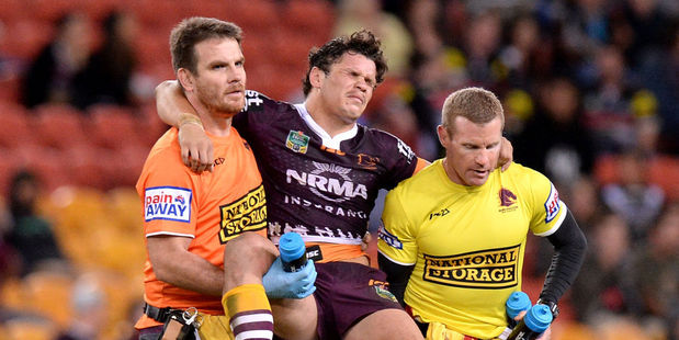 James Roberts of the Broncos is taken from the field injured. Photo / Getty Images