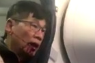 The moment Dao was pulled from his seat and dragged down the aisle was captured on video by other passengers. Photo / @kaylyn_davis Twitter The moment Dao was pulled from his seat and dragged down the aisle was captured on video by other passengers. Photo / @kaylyn_davis Twitter