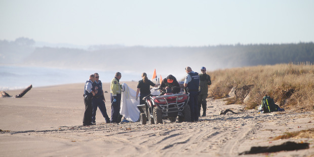 Emergency services at Papamoa Beach where a body was found. Photo/John Borren