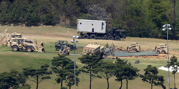 Soldiers from the US Army install a Terminal High-Altitude Area Defense (THAAD) missile defense system at a golf course in Seongju, South Korea, this week. Photo / AP