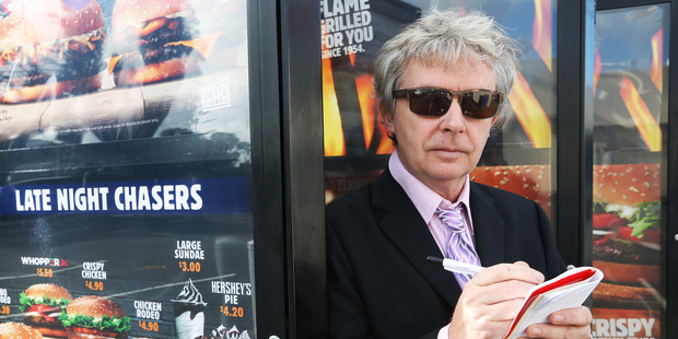 Steve Braunias in Lincoln Rd, Auckland. Photo / Doug Sherring