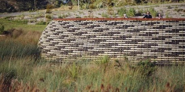 A 'woven' timber structure overlooks restored wetland at Westgate's Kopupaka Reserve