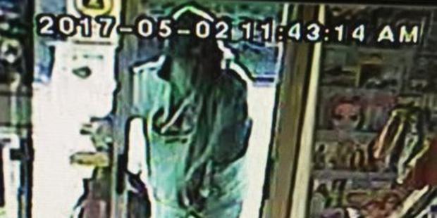 A still from CCTV footage of the person who robbed a Dunedin shop this morning. Photo/Supplied