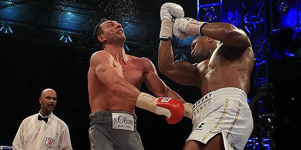 Anthony Joshua and Wladimir Klitschko (grey shorts) in action during the IBF, WBA and IBO Heavyweight World Title bout at Wembley Stadium. Photo / Getty