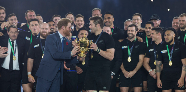 Prince Harry presents the Rugby World Cup All Blacks captain Richie McCaw after the 2015 final at Twickenham. Photo / file