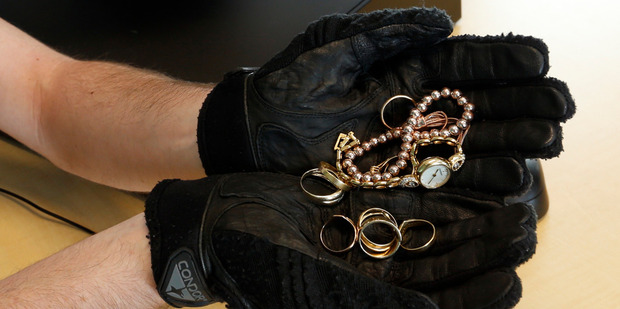 Whangarei police Constable Andrew hunter wants help finding owners for this stolen jewellery. Photo / John Stone