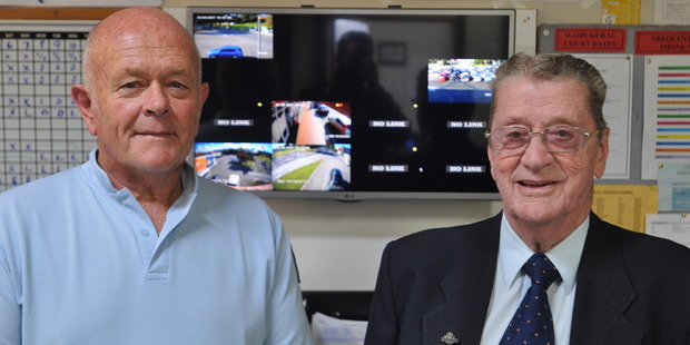 Constable Glynn Sharp and Lloyd Lawrence in front of the screen inside Waipukurau Police station which shows footage streamed from some of the 'state-of-the-art' CCTV cameras that have been already installed. Photo / Clinton Llewellyn.