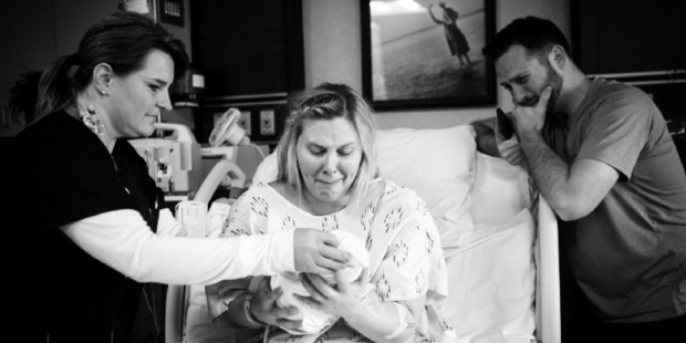 Royce and Keri Young meeting their daughter, Eva, after she was stillborn. Photo / Mitzi Aylor-Aylor Photography, Washington Post