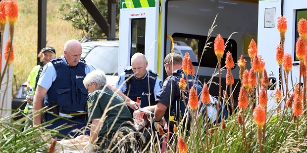 Police attend what is beileved to be a machete attack in Taieri mouth where a mans hand was nearly severed. Photo / Otago Daily Times
