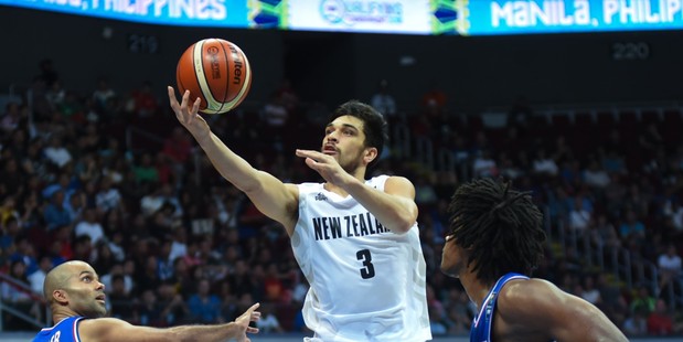 Shea Ili drives to the hoop against France during their Olympic Qualifying match. Photo / Getty Images