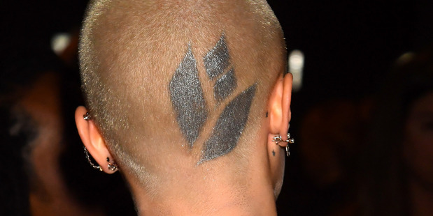 Cara Delevingne reveals her new tattoo at the MTV Movie & TV Awards in Los Angeles. Photo / Getty
