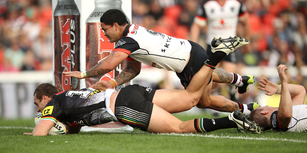 Isaah Yeo of the Panthers scores a try against the Warriors. Photo / Getty