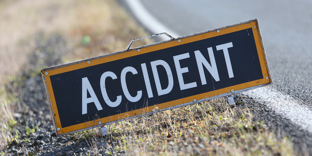 A person is trapped in a wreck after the two-car crash. Photo / File