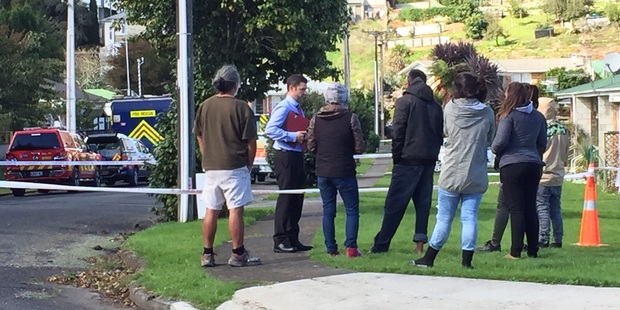 Roma Joseph's family talk with police at the Little St cordon last week. Photo/Belinda Feek