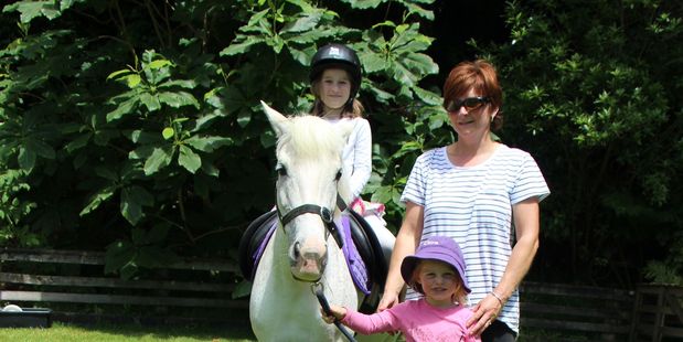 Hayley Webb (7) enjoyed a ride on Prickles, led by Christine Evans and Clare Coatsworth (5).