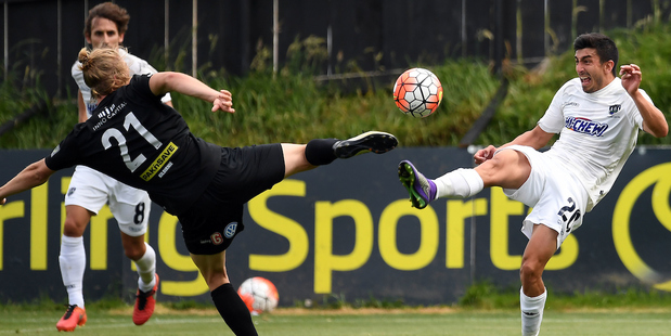 Auckland City FC's Emiliano Tade and Team Wellington's Niko Kirwan. Photo / Photosport