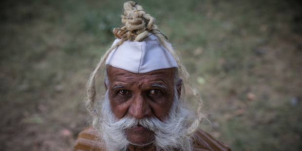 Ramesh Chand Kushawh, 78, ties his moustache in a ball on his head to keep it safe. Photo / Australscope