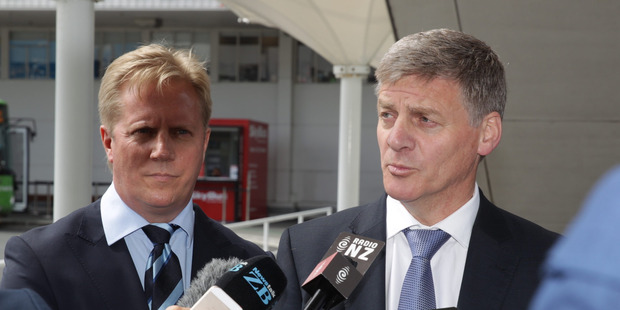 Prime Minister Bill English speaks to the media at Auckland Airport before flying to Europe. He is joined by Trade Minister Todd McClay. New Zealand Herald by Nick Reed.