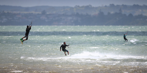Our windy summer has been good news for some, such as these kitesurfers pictured off Pt Chevalier Beach in December. Photo / Doug Sherring.