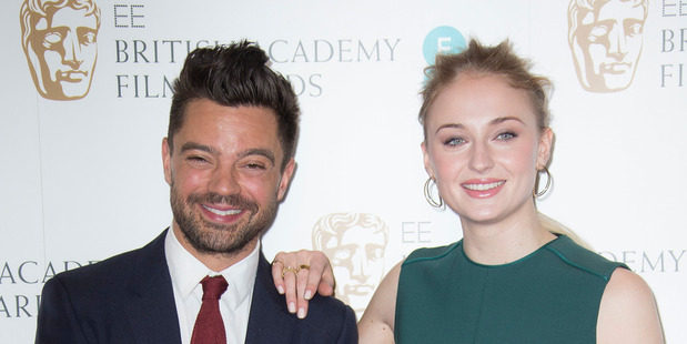Actors Sophie Turner, right, and Dominic Cooper pose for photographers after announcing the nominations for the EE British Academy Film Awards in 2017. Photo/AP