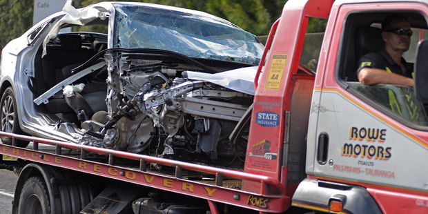 Tina Jennen's car mangled in a collision on State Highway 2 south of Katikati, prompting her partner to call for safety upgrades. Photo/George Novak