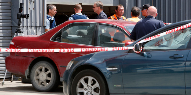 Police at the scene of the raid on the Whangarei Daktory. Photo / Michael Cunningham