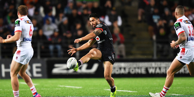 Shaun Johnson kicks during the Warriors' clash against the Dragons. Photosport