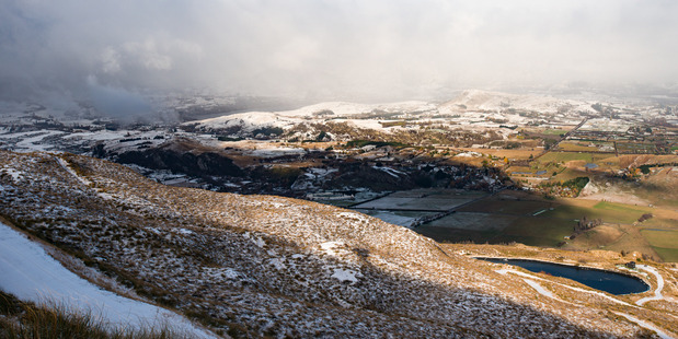 The Wakatipu Basin this afternoon with its light dusting of snow. Photo / Coronet Peak