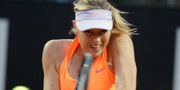 Maria Sharapova, of Russia, returns the ball to Mirjana Lucic-Baroni, of Croatia. Photo / AP