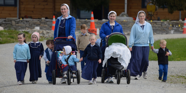 Families from the Gloriavale community enjoy a stroll.