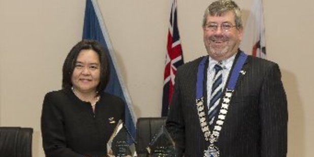 Gigi Crawford of Zealong Tea Estate and mayor Allan Sanson of Waikato District Council, with the three trophies won by Zealong Tea Estate at the 2017 Global Tea Championship Fall in Colorado, US.