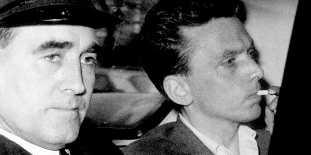 Ian Brady, right, is escorted as he arrives at the courthouse in Hyde, Cheshire, England. Photo / AP