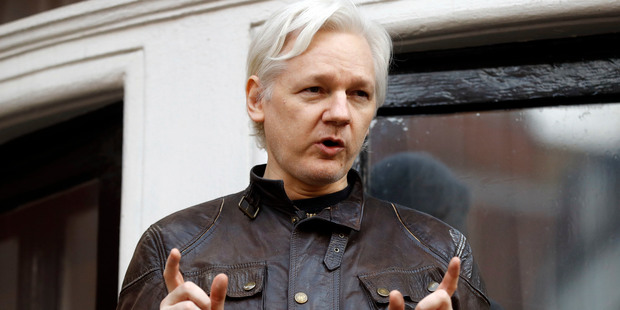Julian Assange speaks to the media outside the Ecuadorian embassy in London. Picture / AP