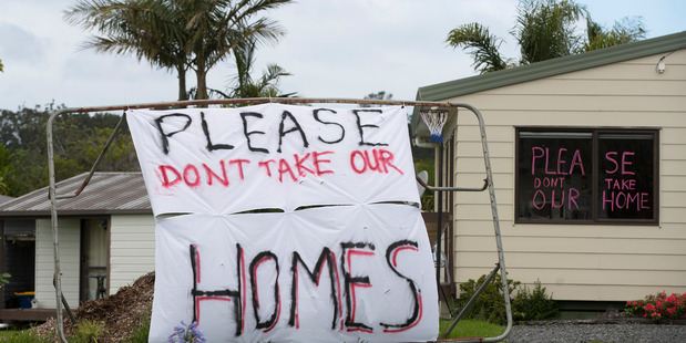 Protest signs outside Oratia properties earlier this year. Photo / Brett Phibbs
