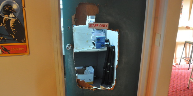 A man kicked through the door of the bar and restaurant's office, located the key to a safe and then stole cash.