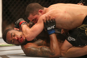 Robert Whittaker (on top), pictured during his win over Mike Rhodes in Auckland in 2014, is on a seven-fight winning streak. Photo / Photosport