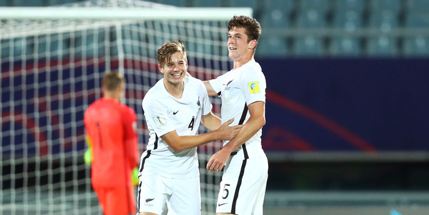 Luke Johnson and Hunter Ashworth of New Zealand celebrate after the team;s 3-1 win over Honduras