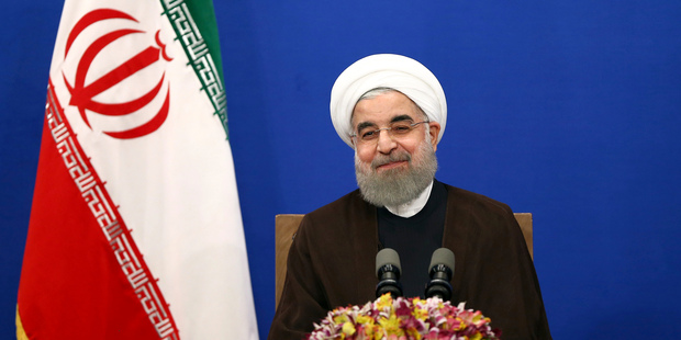 Iranian President Hassan Rouhani attends a televised speech after he won the election. Photo / AP