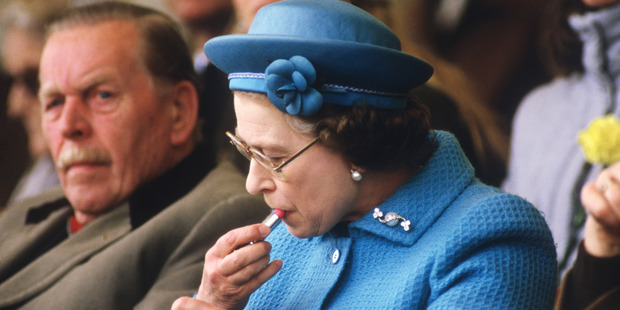 The Queen topping up her lippy at the Windsor Horse Show. Photo / Getty