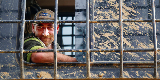 Hauler driver Gavin Baldwin spends his days in the cab dragging logs from the depths of the gullies using a video camera for guidance.