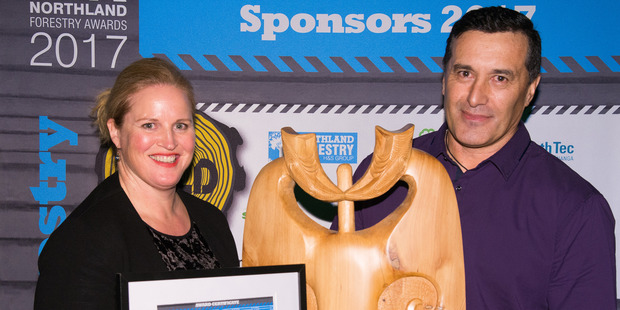 Associate Primary Industries Minister Louise Upston awards the 2017 Northland Forestry Skilled Professional of the Year trophy to Shayne Maxwell, health and safety manager and company trainer for Kohurau Contracting at Kaikohe.