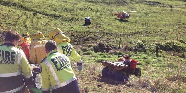 Emergency services attend a quad bike accident on a farm near Whangamata last year. An average 850 Kiwis are injured on farm quad bikes each year - and five die. Photo / File